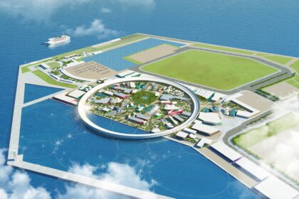 render van kustgebied met water, groen en cirkelachtig bouwwerk